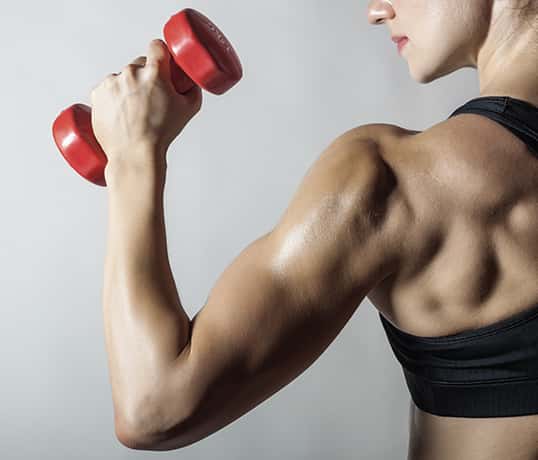 Exercising forearms using small weights.